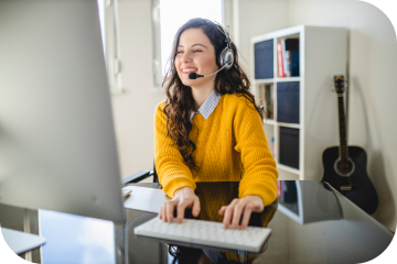 Woman with headset on computer